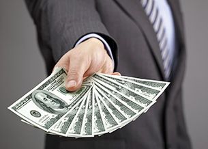 pawn shop worker handing money