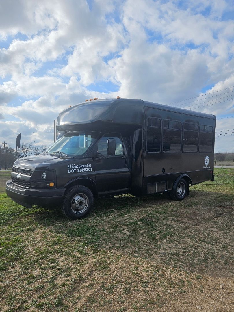 white 20 passenger party bus for SATX outside view