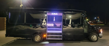 black Austin party bus with 14 passengers outside view