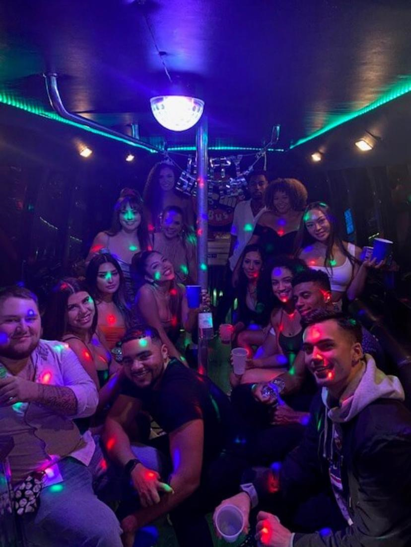 black Austin party bus with 14 passengers inside view
