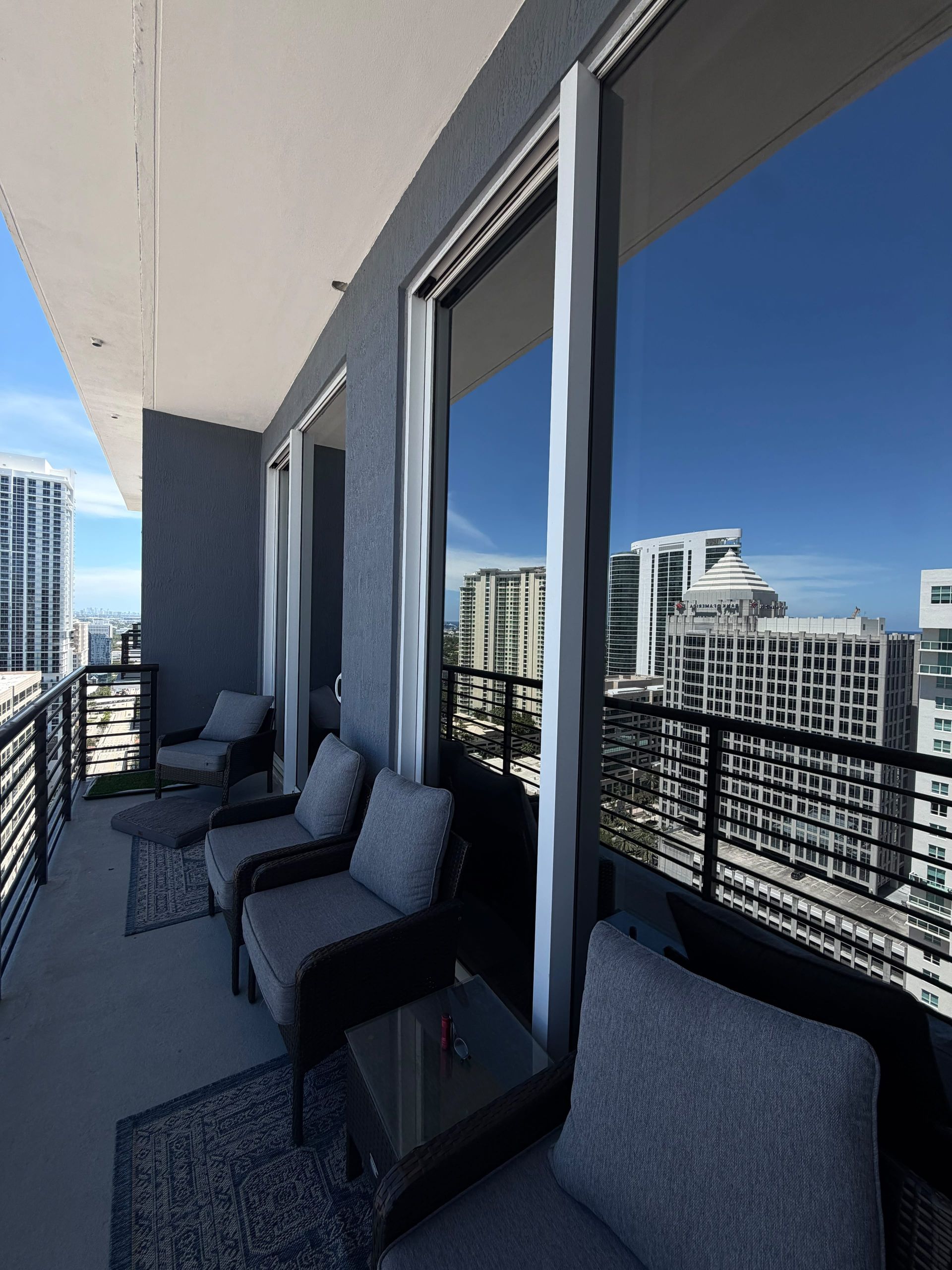 High-rise condo window tinting on balcony glass in South Florida