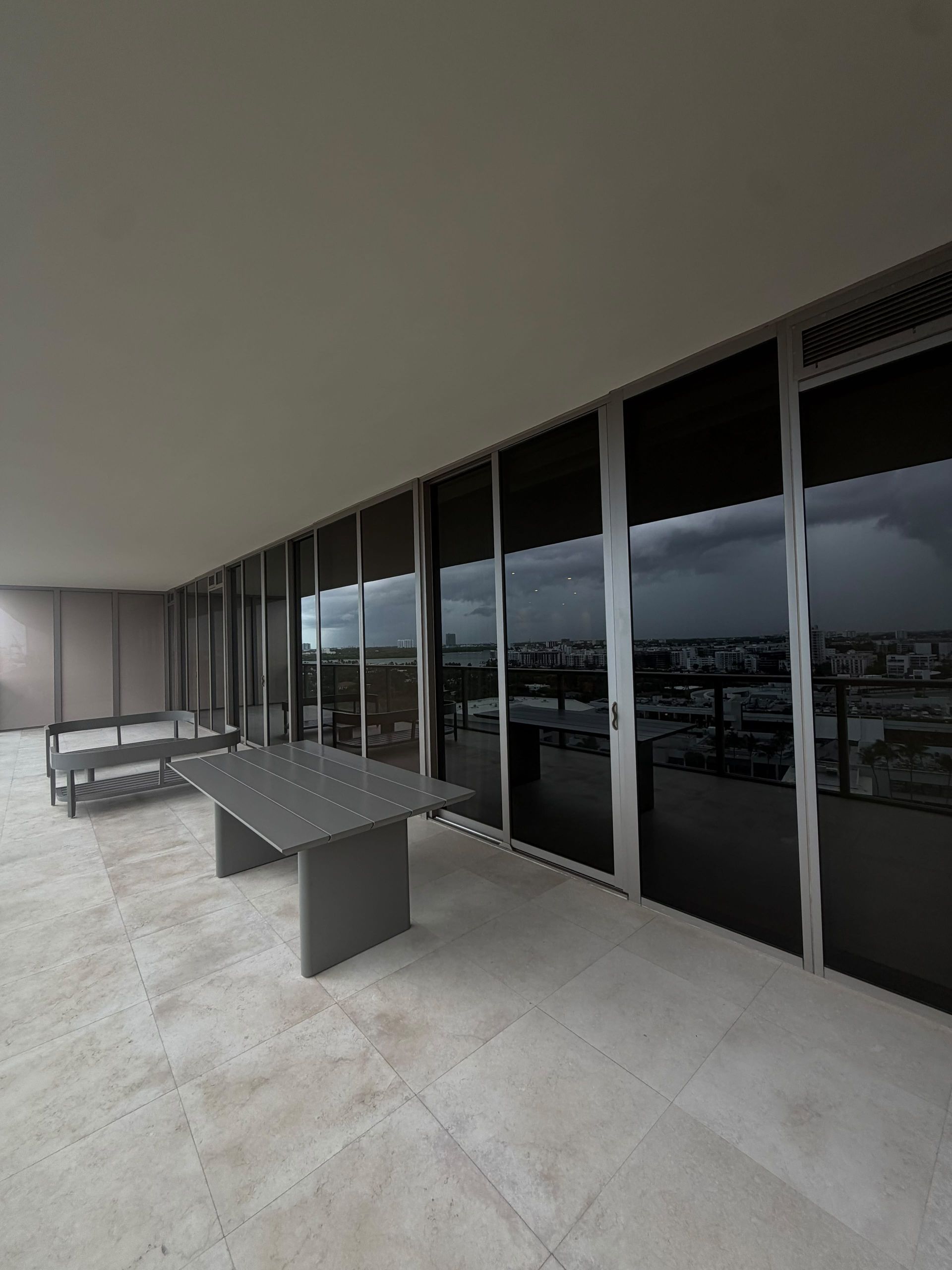 High-rise condo window tinting on floor-to-ceiling windows in South Florida