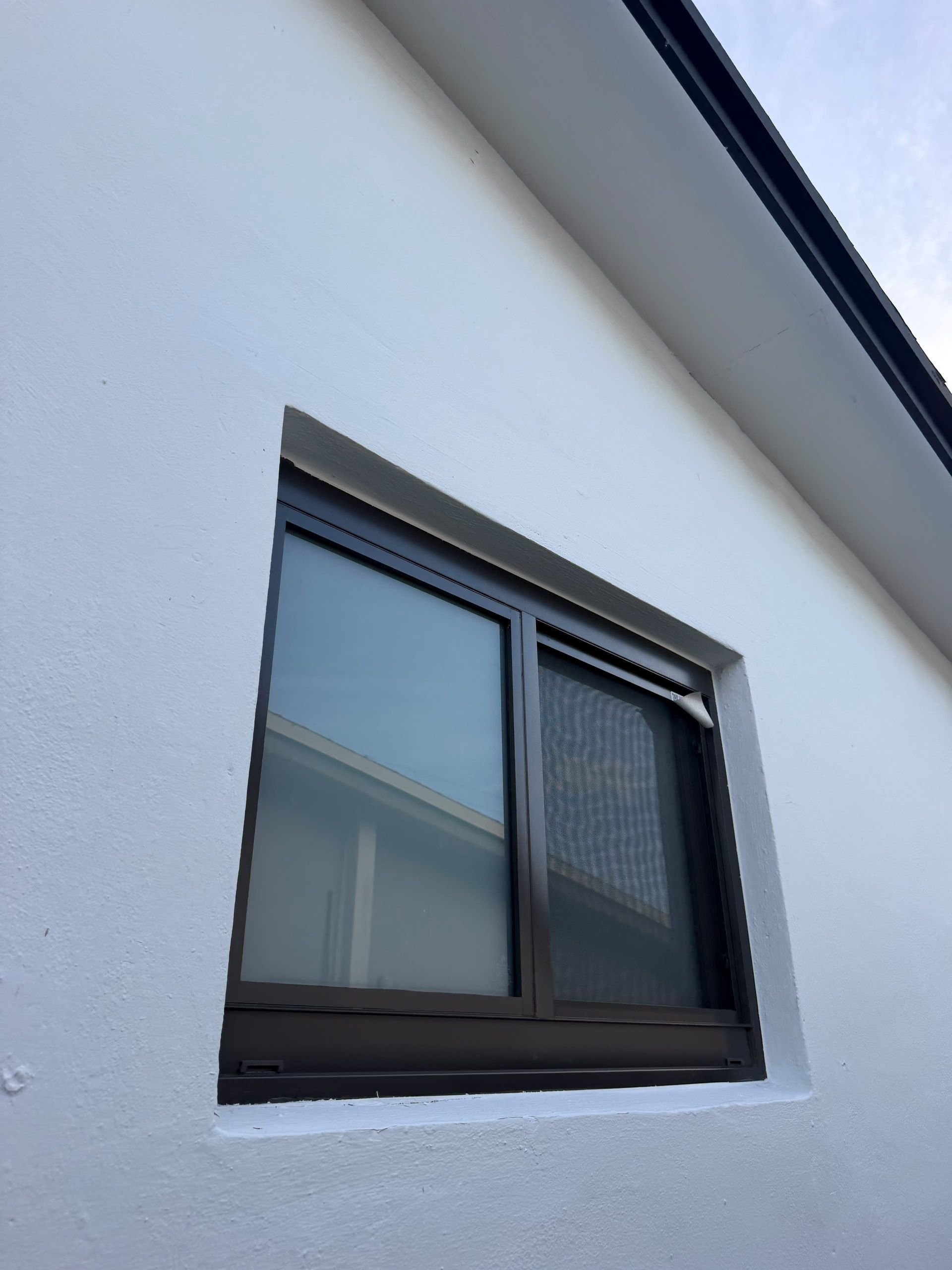 Privacy window film installed on a residential window for added daytime privacy