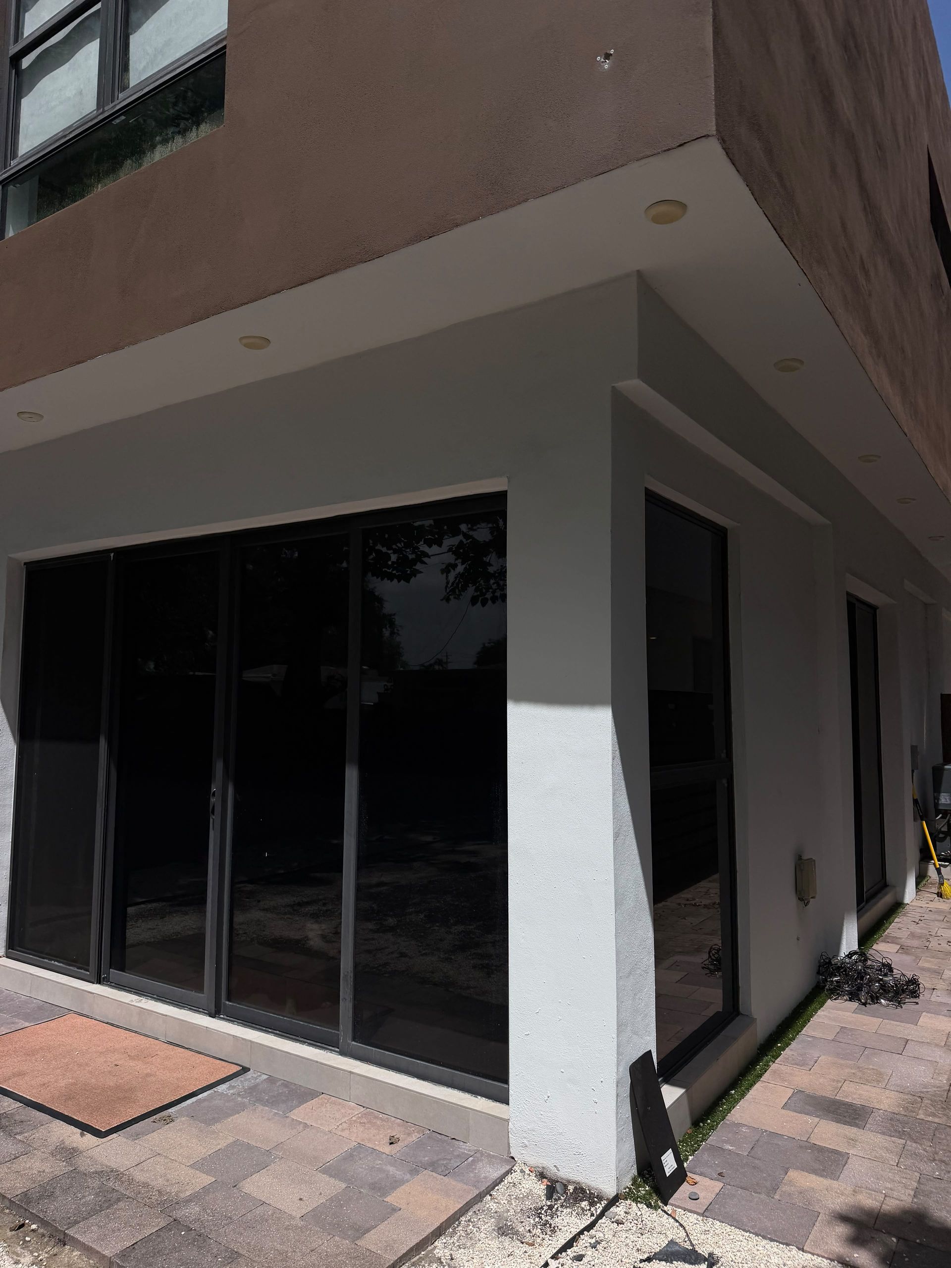 Residential window tinting on sliding glass doors in a South Florida home