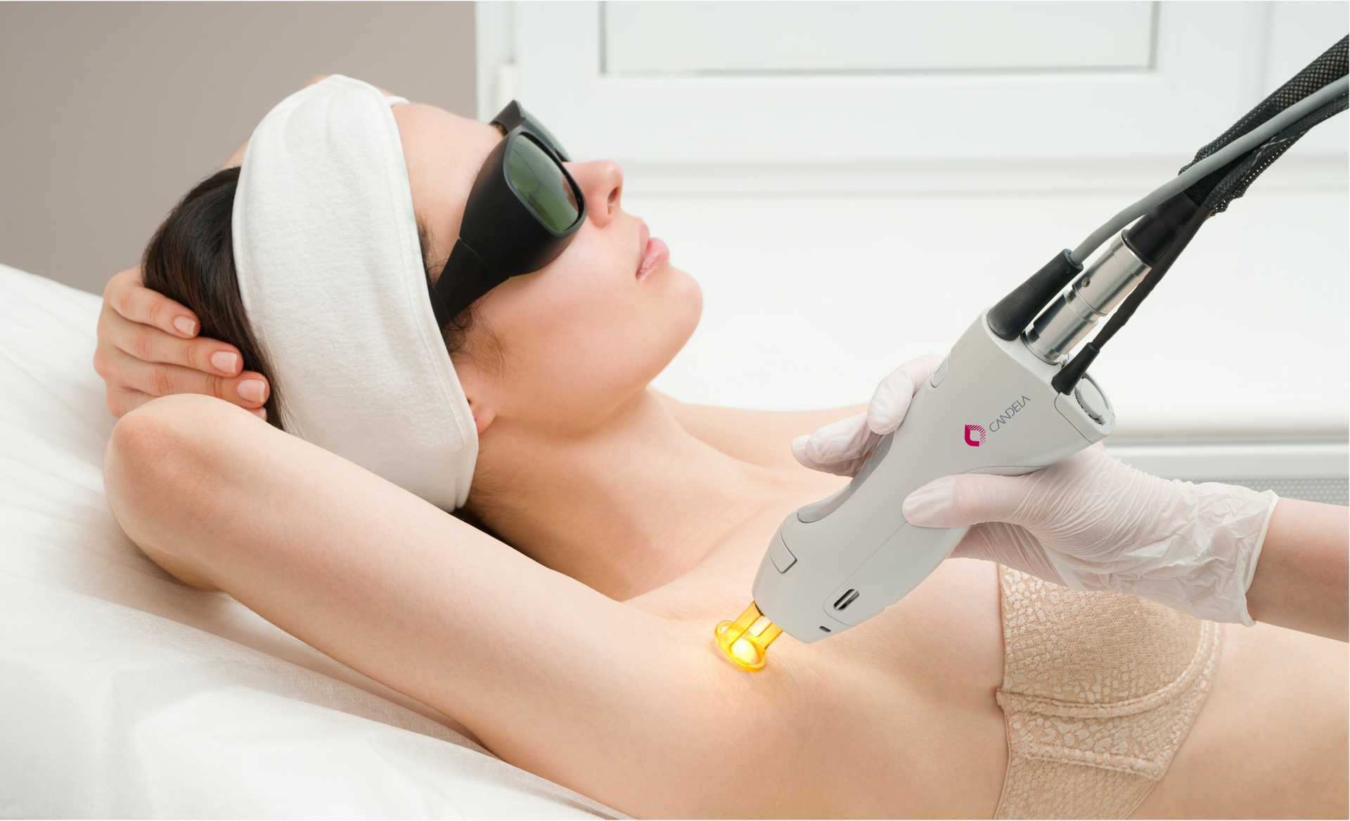 A patient wearing eye protection during laser hair removal