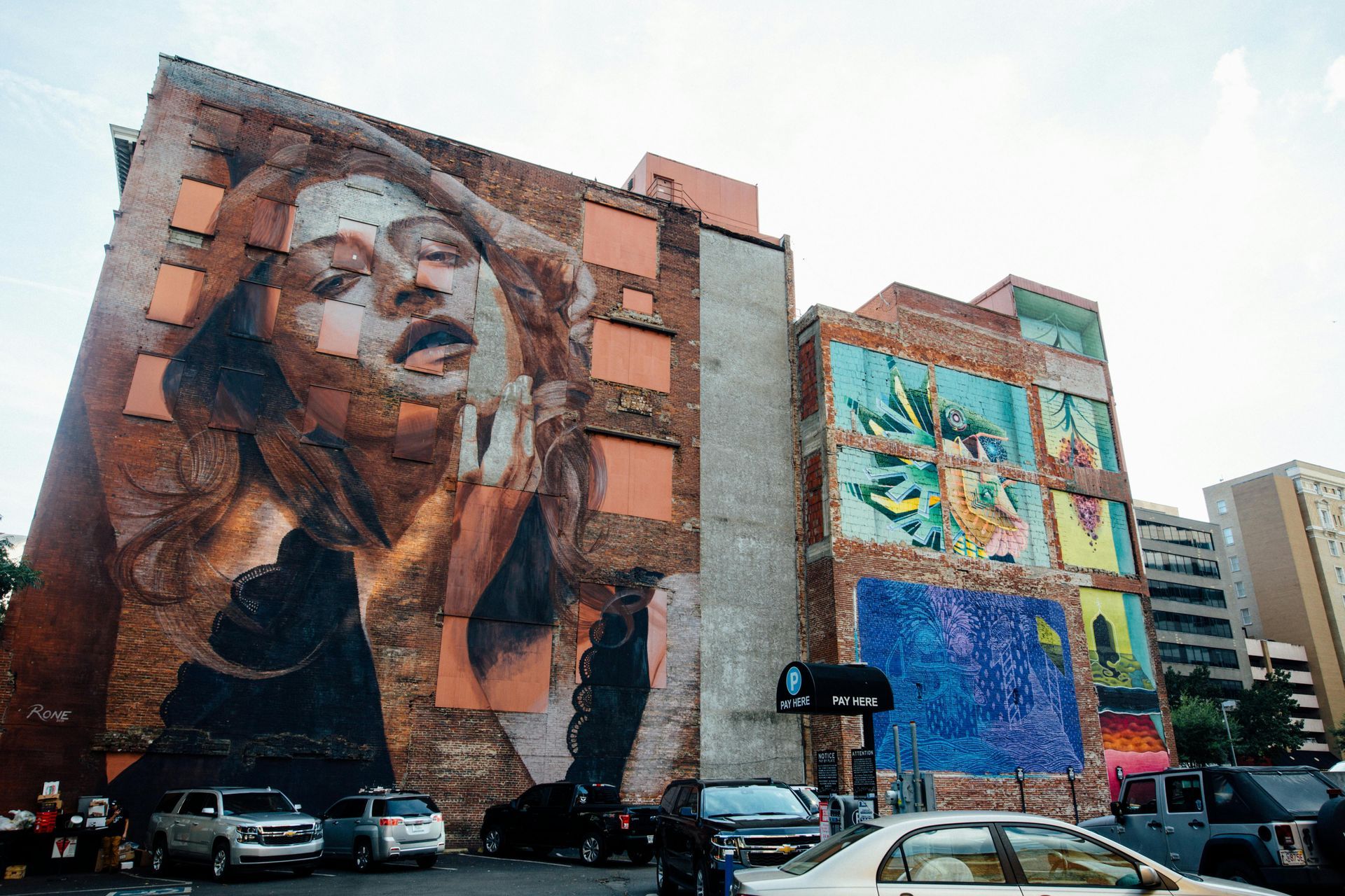 Art work on brick exterior walls, provides details into artist lofts in NYC