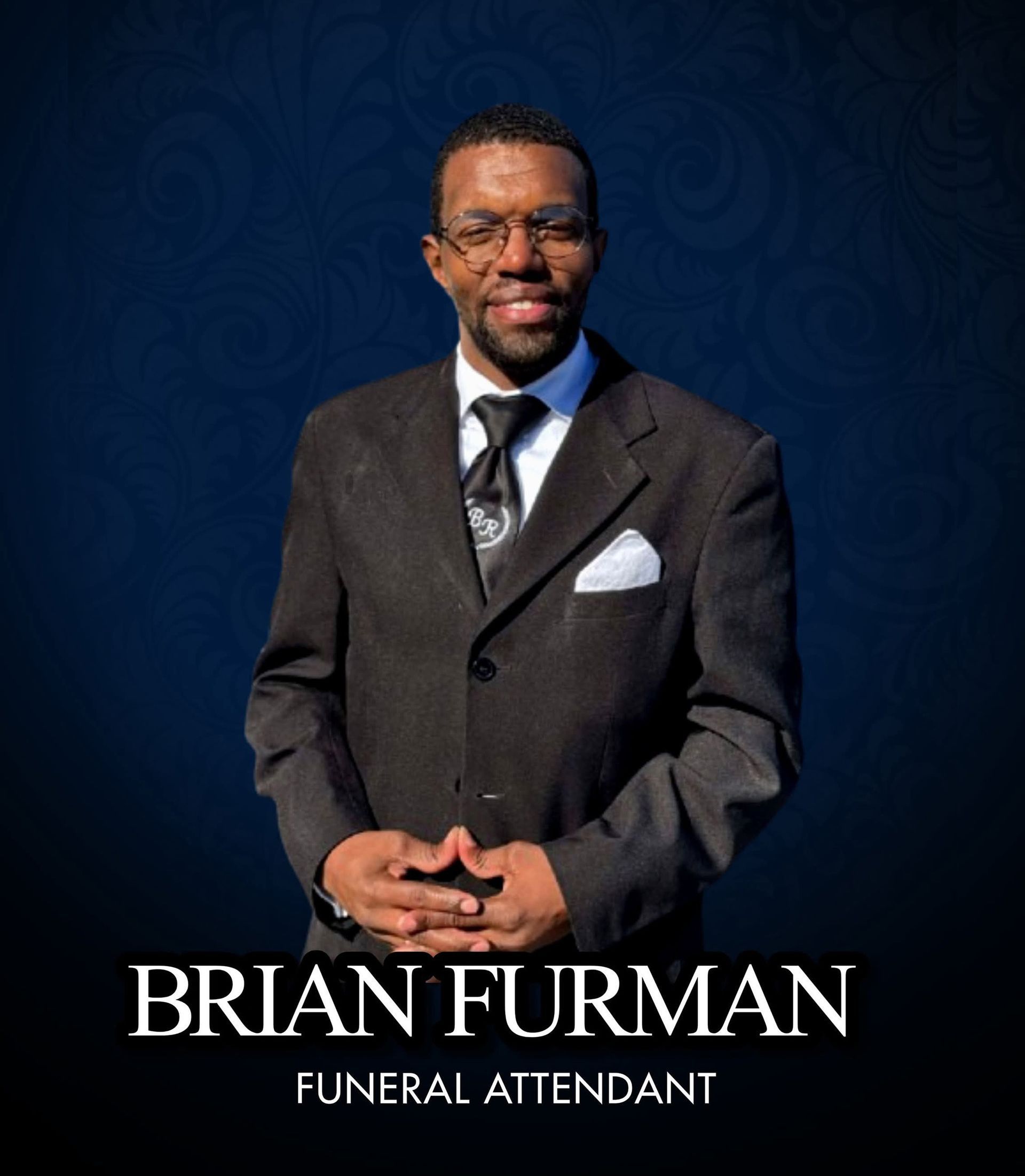 Portrait of Brian Furman in a dark suit on a blue patterned background, labeled “Funeral Attendant”