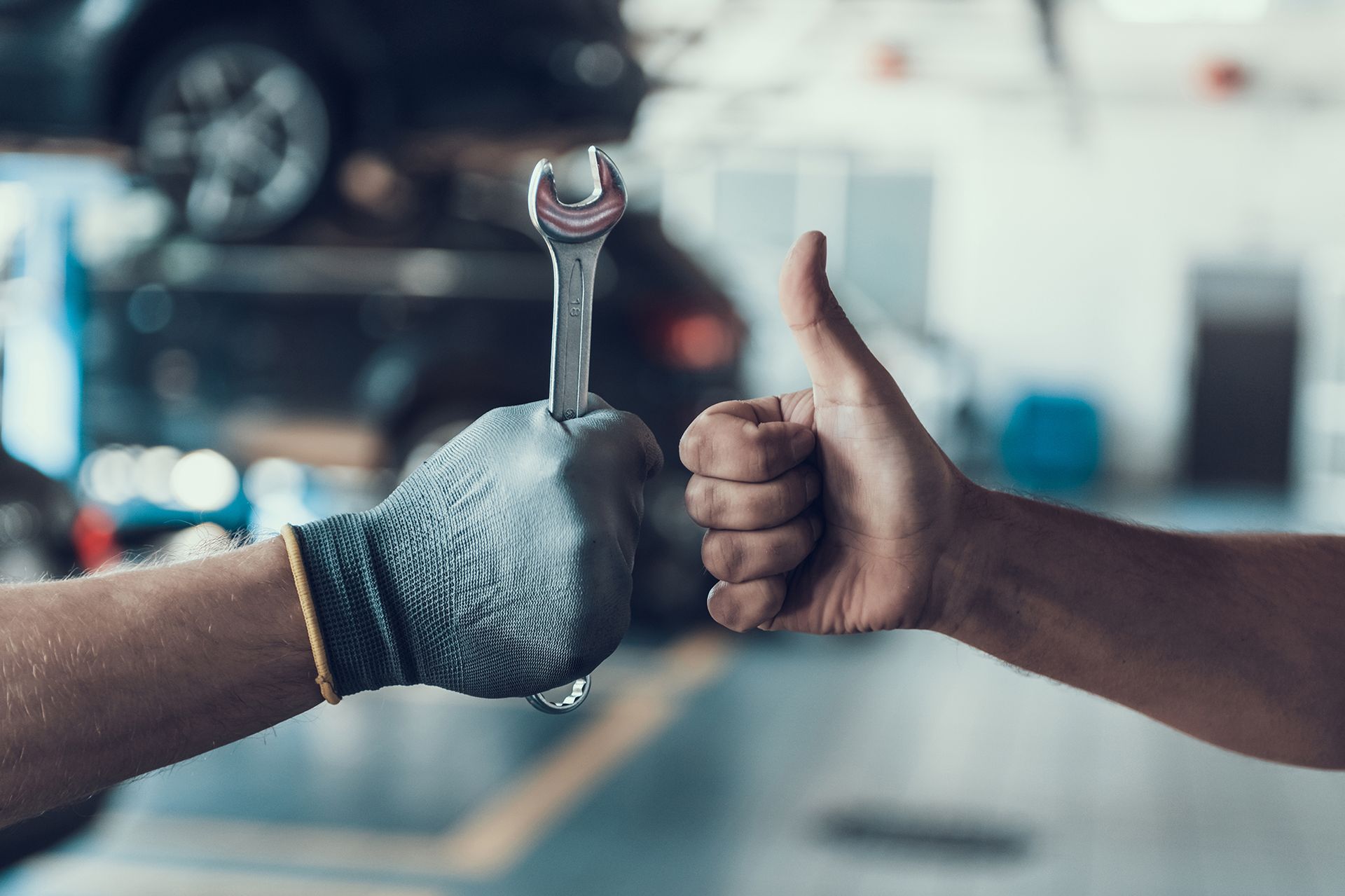 Thumb up and Mechanic Hand With Tool