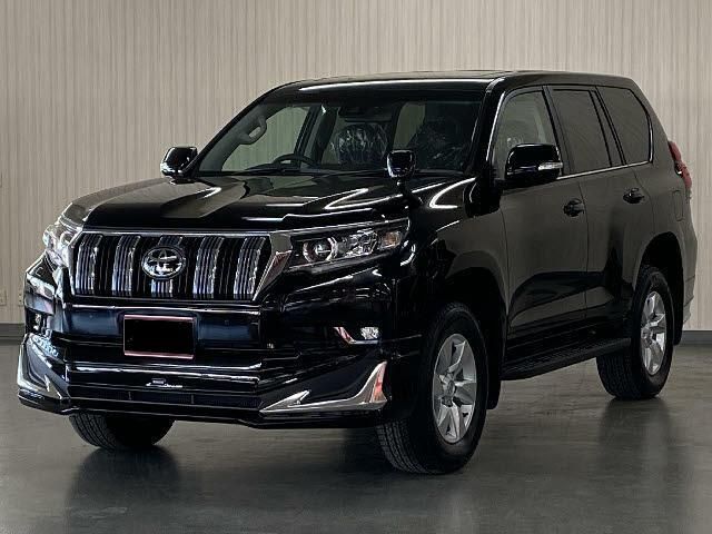 Black SUV photographed in a studio with a light gray backdrop
