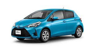 Blue compact hatchback car on a white background, shown in side view.