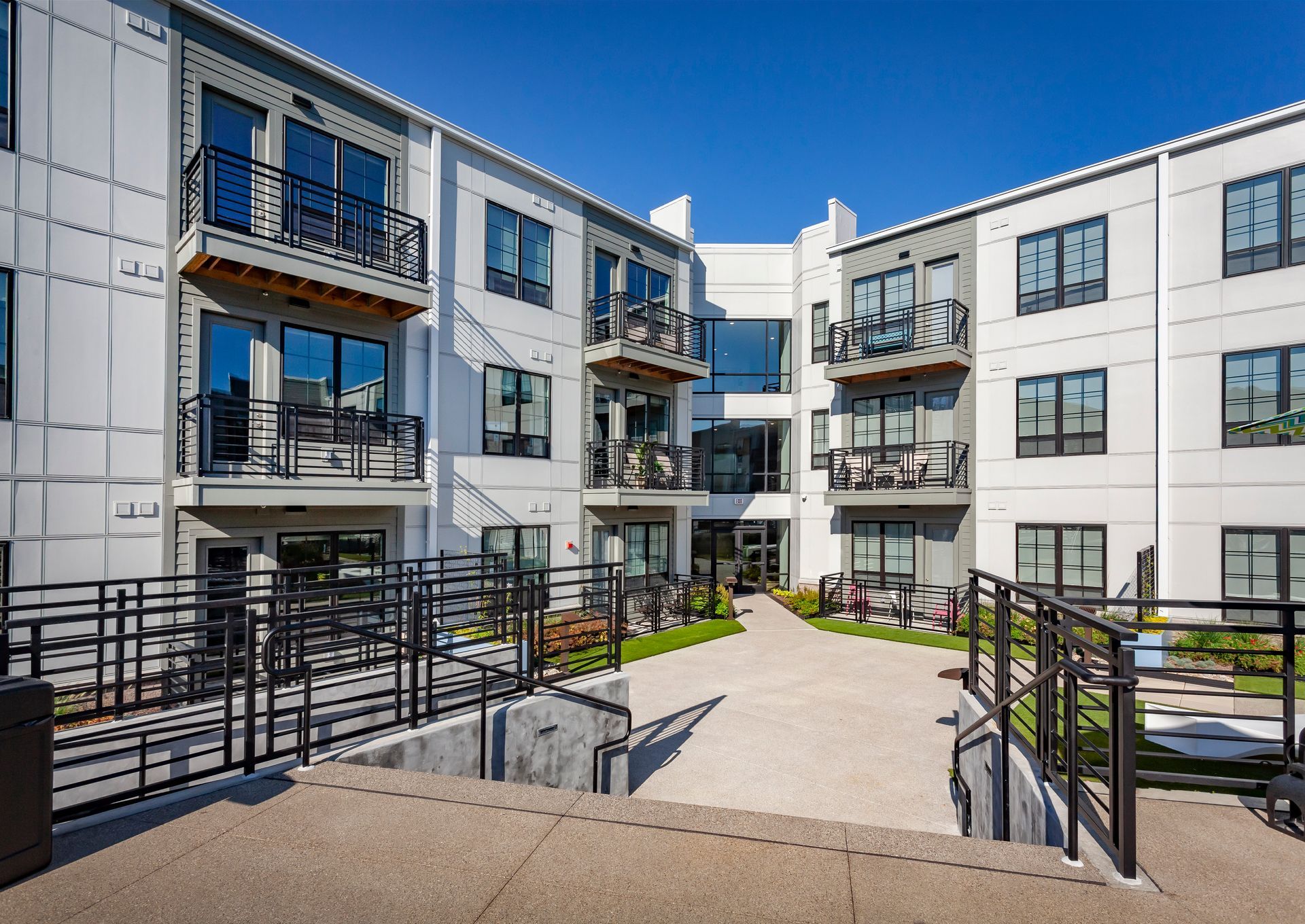 A large apartment building with a lot of windows and balconies at Nickel Plate.