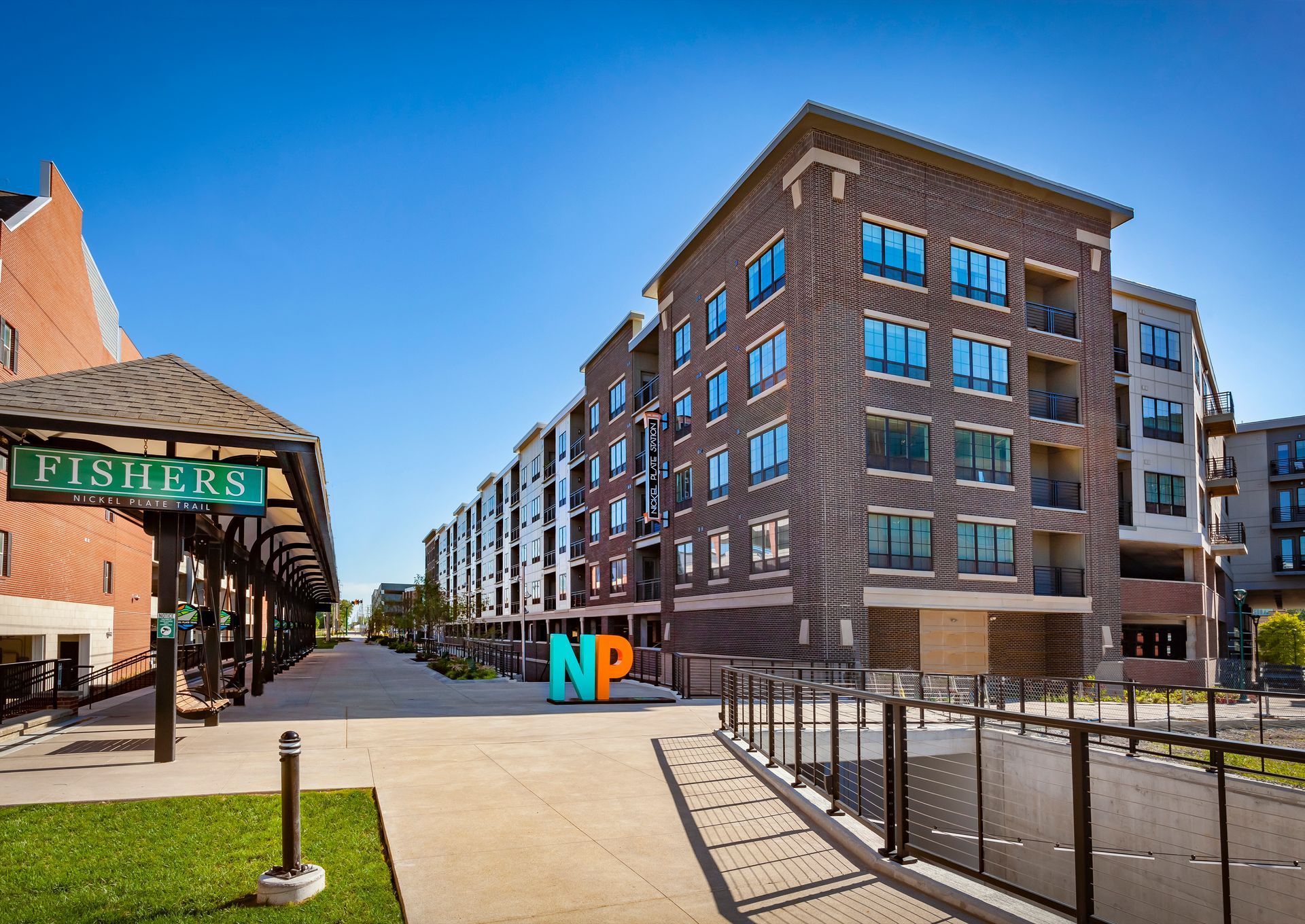 A large brick building with a sign that says np in front of it at Nickel Plate.