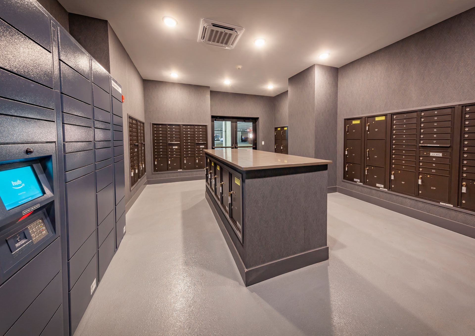 A large room filled with lots of mailboxes and a counter at Nickel Plate.