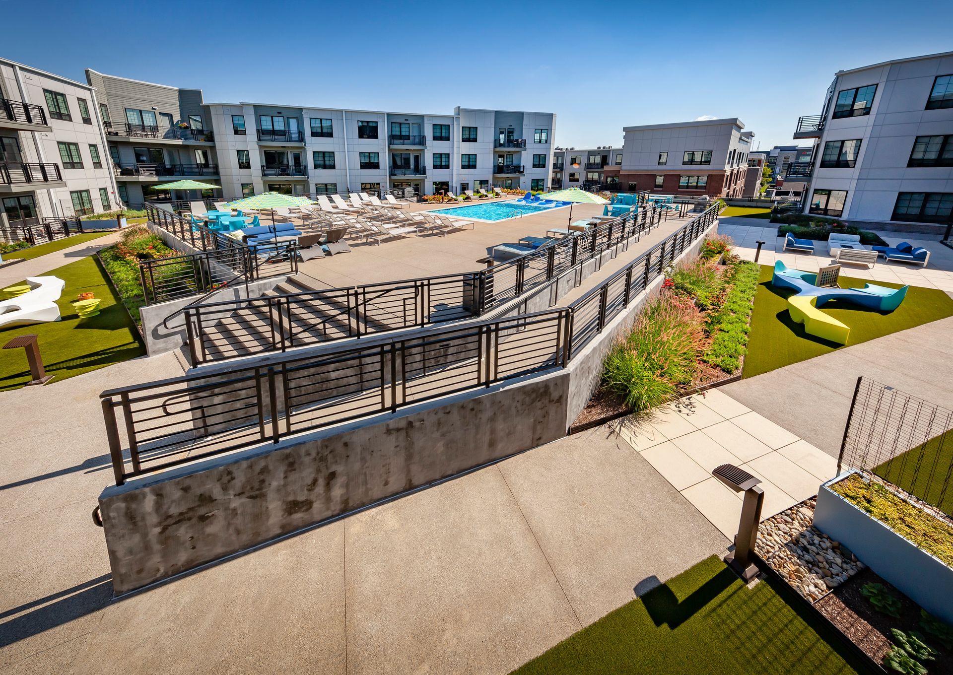 An aerial view of a large swimming pool surrounded by buildings at Nickel Plate.