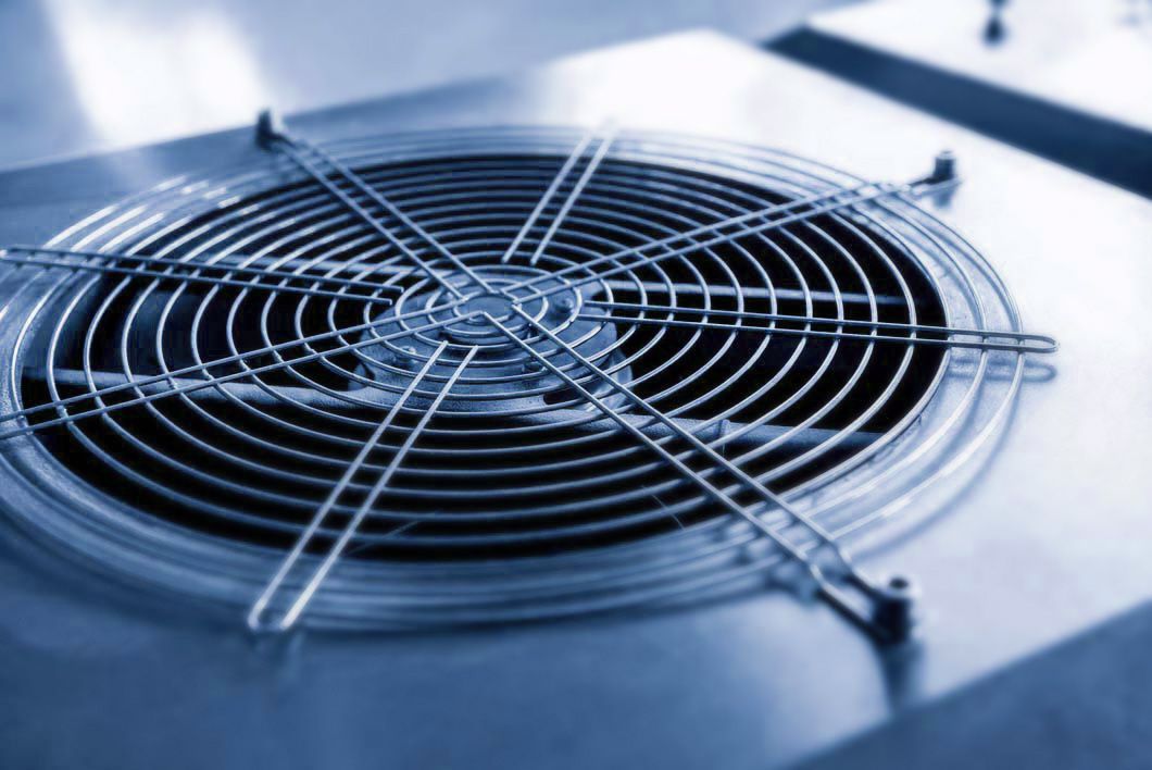 A close up of a fan on a machine.