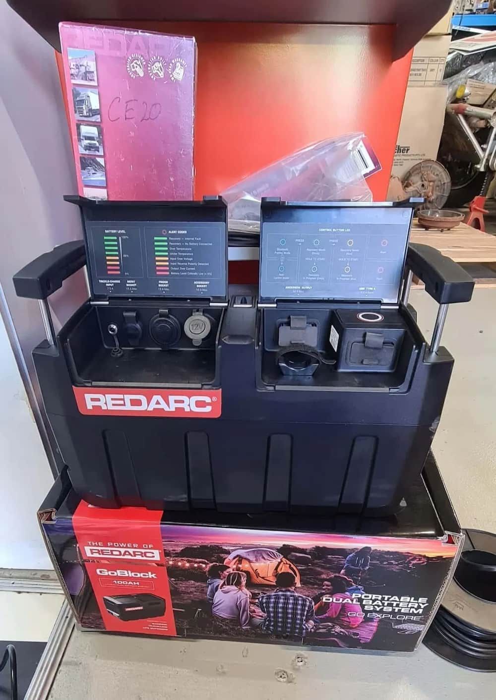 A Redarc Battery Charger Is Sitting On Top Of A Box — KC Auto Electrics In Ciccone, NT