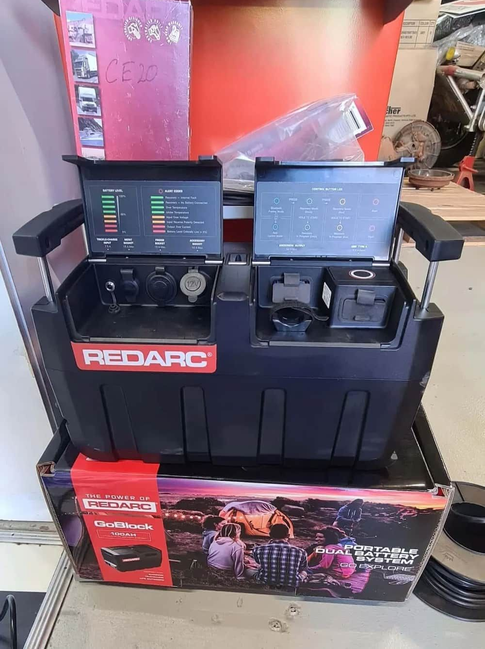 A Redarc Battery Charger Is Sitting On Top Of A Box — KC Auto Electrics In Ciccone, NT