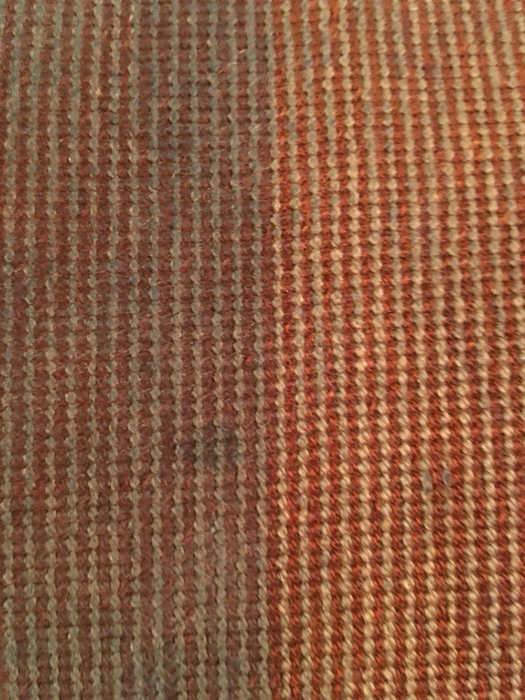 A close up of a piece of fabric with a striped pattern.
