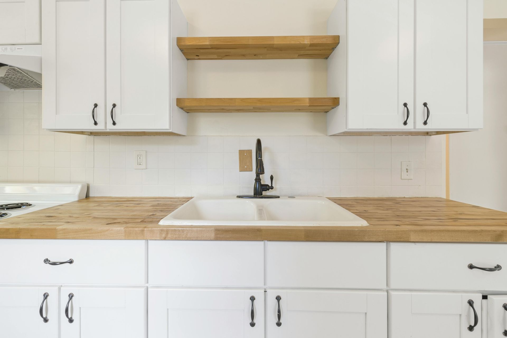 Cream-Colored Kitchen Cabinets and Drawers with Gray Countertop — Paul Tagget Kitchens In Ballina, NSW