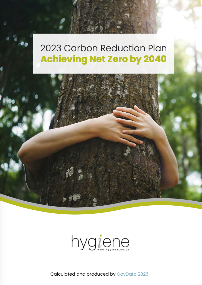 A person is hugging a tree in a forest.