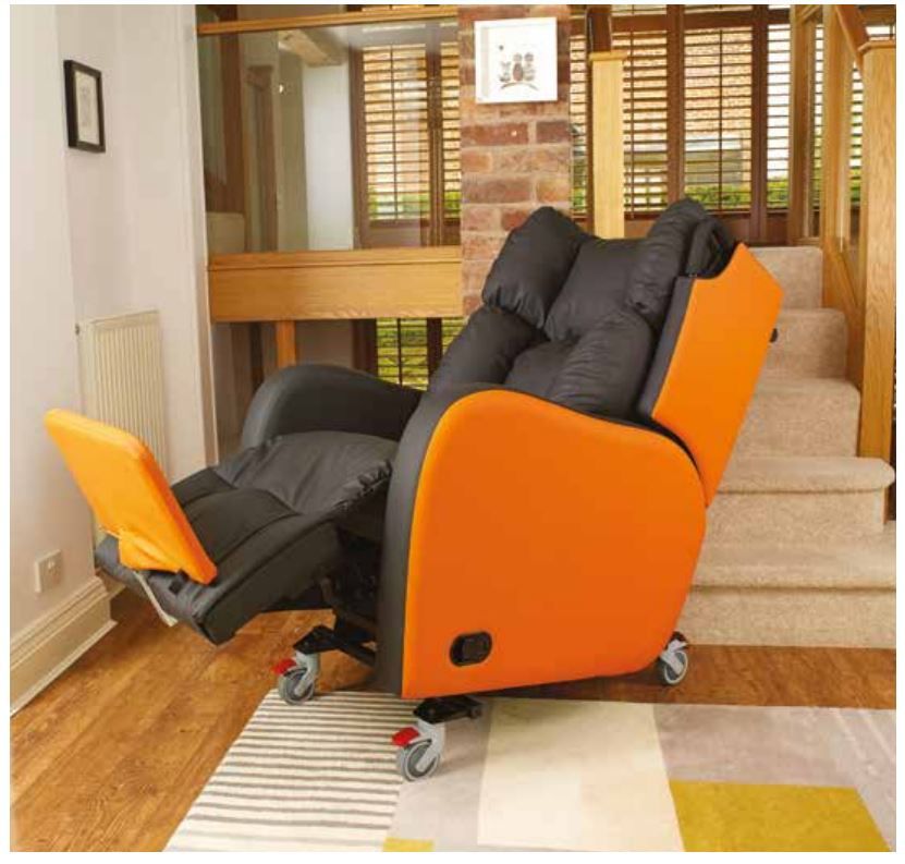 An orange and black recliner in a living room next to stairs