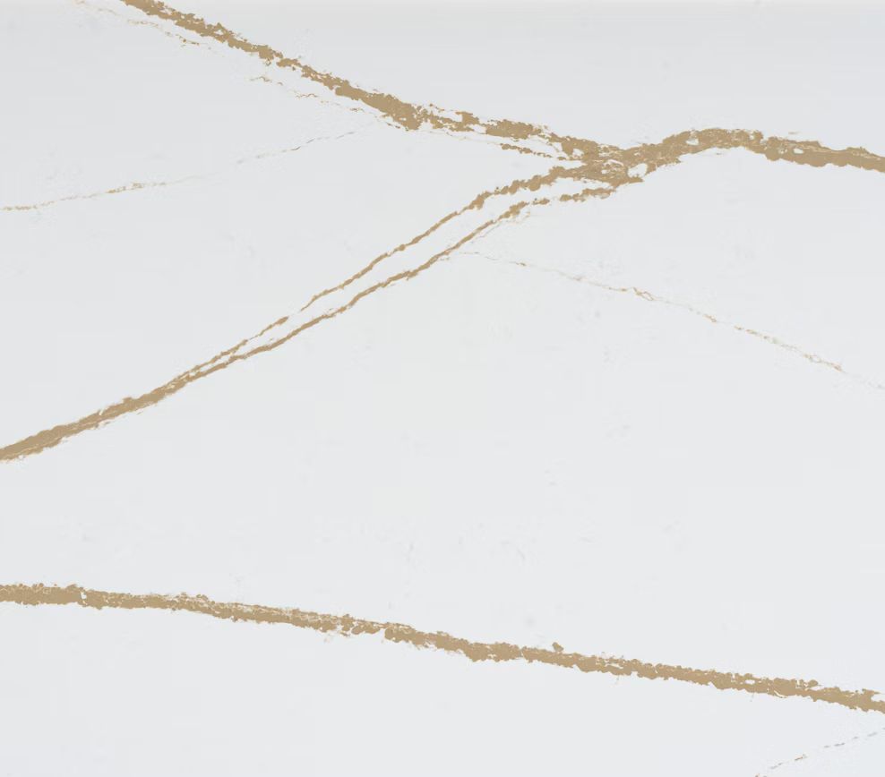 White surface with gold veining, resembling marble.