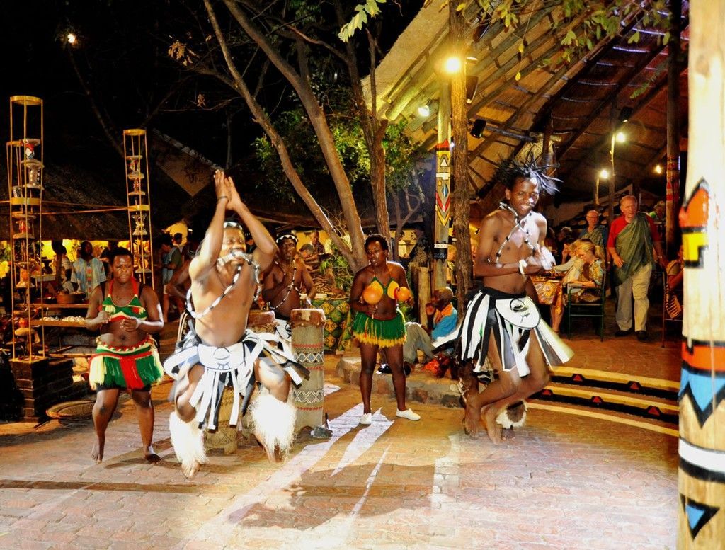 A group of people are dancing in front of a crowd
