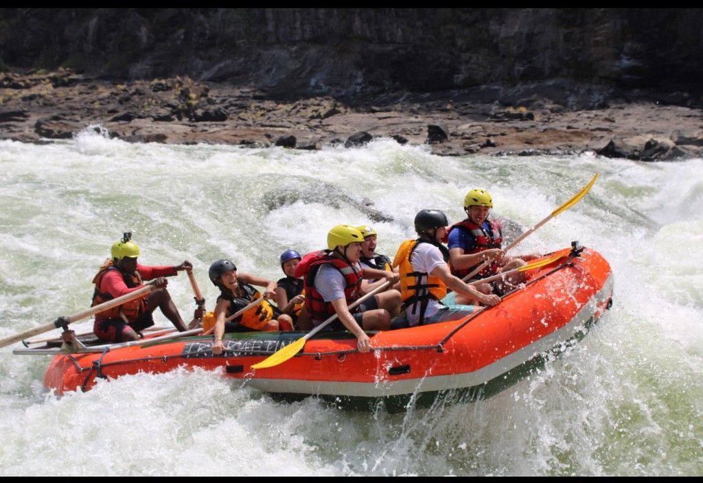 A group of people are rafting down a river.