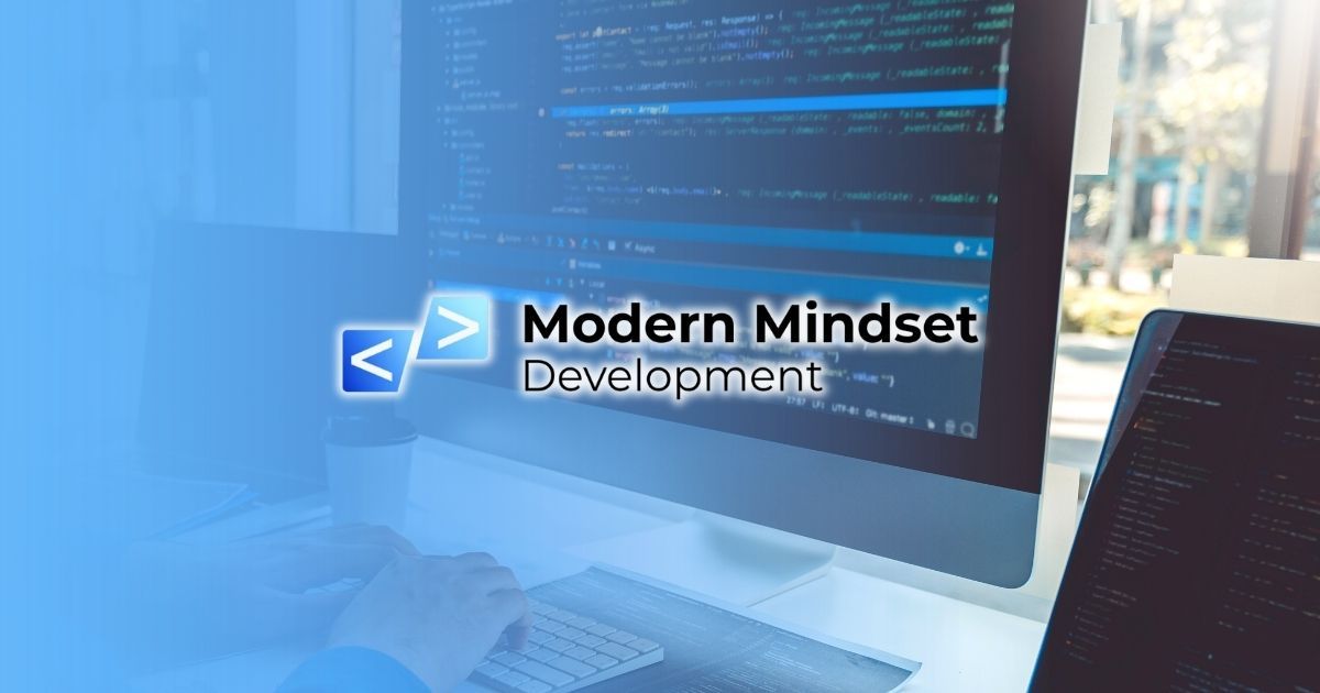 Modern Mindset Development displayed on a desktop monitor in a blue-toned workspace