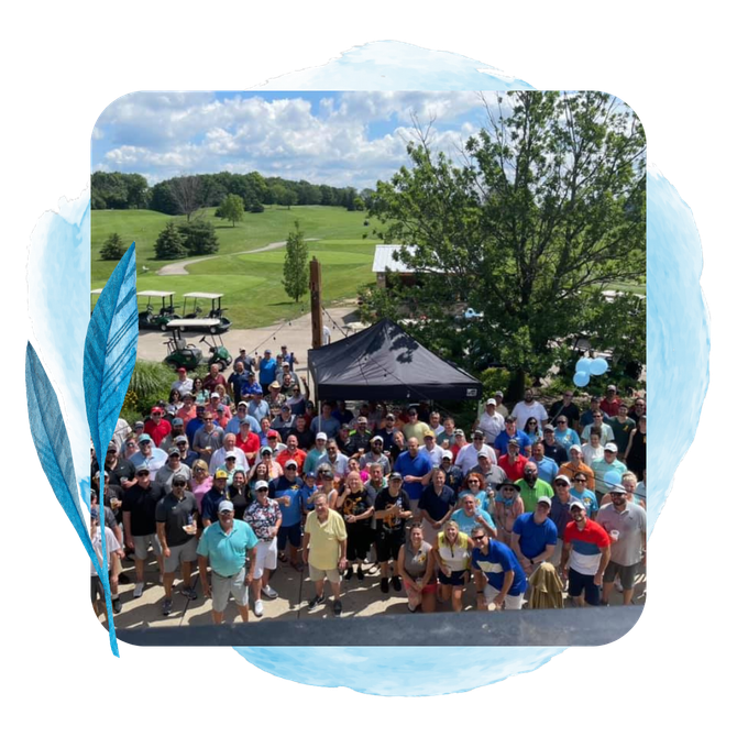 a large group of people standing in front of a golf course