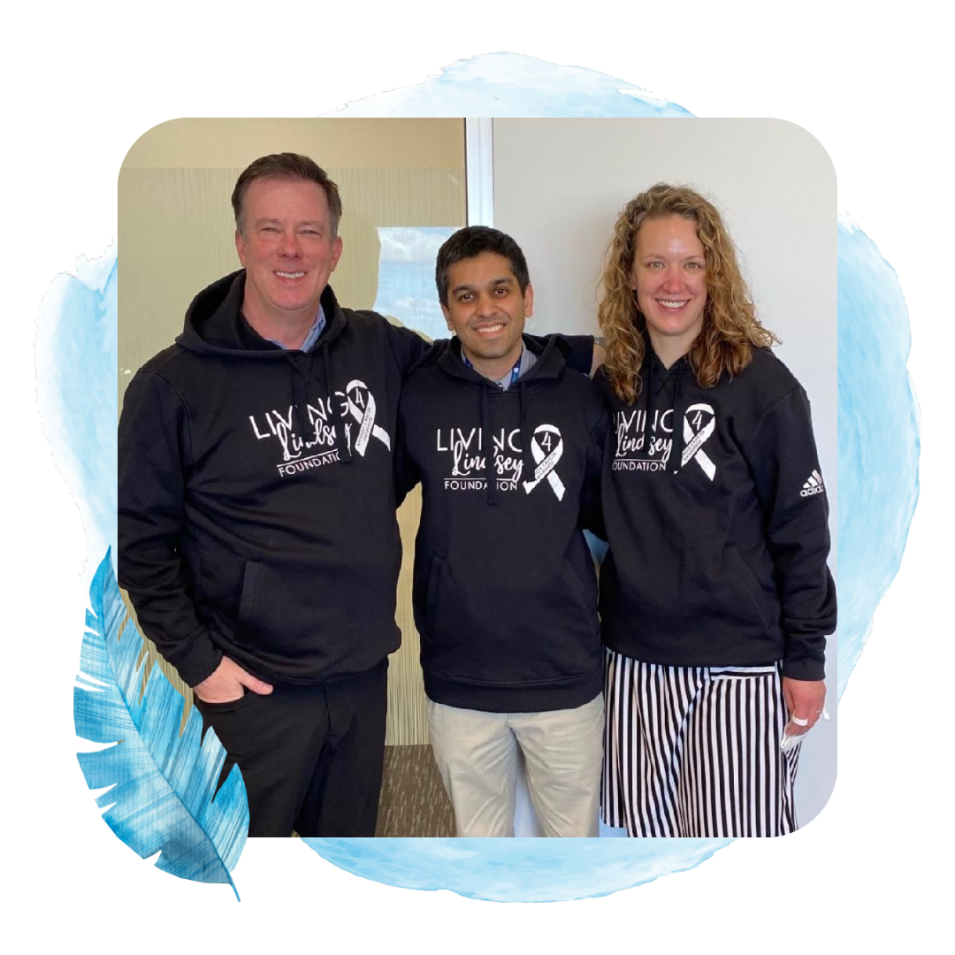 three supporters wearing hoodies that say living4lindsey foundation