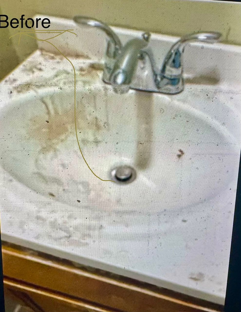Dirty bathroom sink with stained surface and chrome faucet.