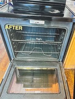 Clean oven interior with racks, glass door, and