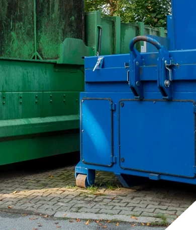 A white industrial trash compactor against a dark blue background with the CAB logo on the side.