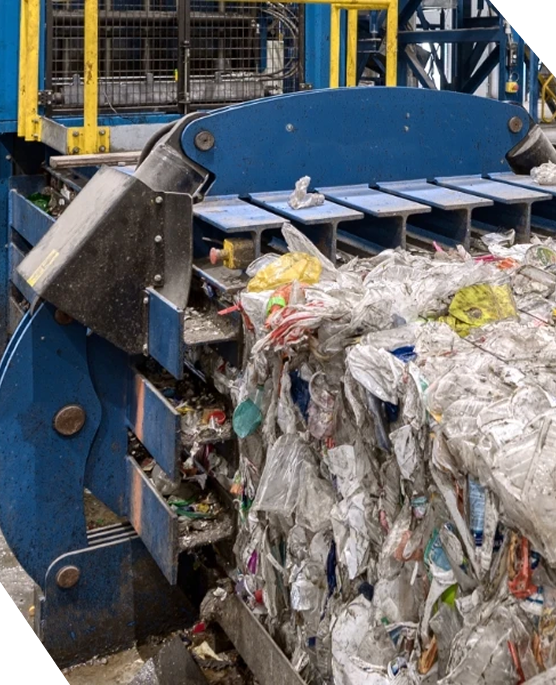 A white industrial trash compactor against a dark blue background with the CAB logo on the side.