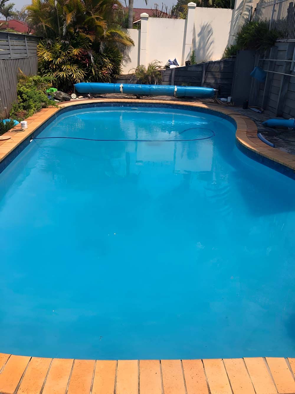 Swimming Pool With Vacuum Cleaner Under The Pool Cleaning — Pool Zone in Laurieton, NSW