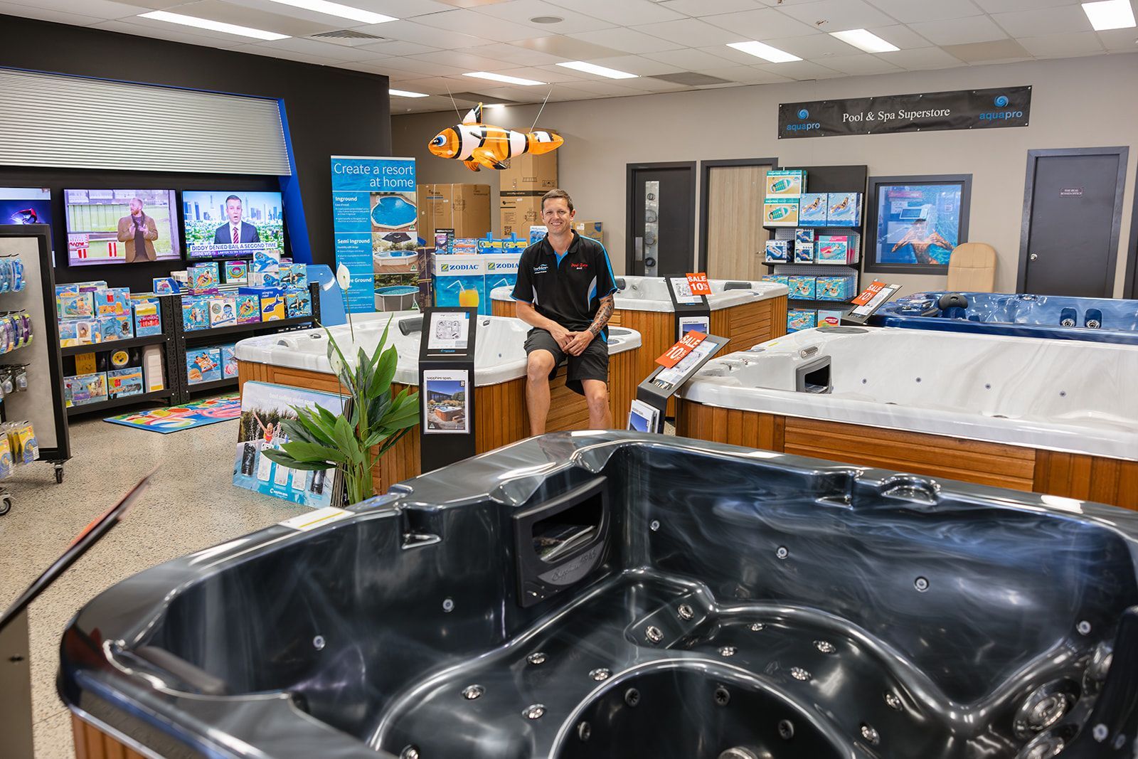 A White Pool Spa With A Wooden Base In A Store — Pool Zone in Port Macquarie, NSW