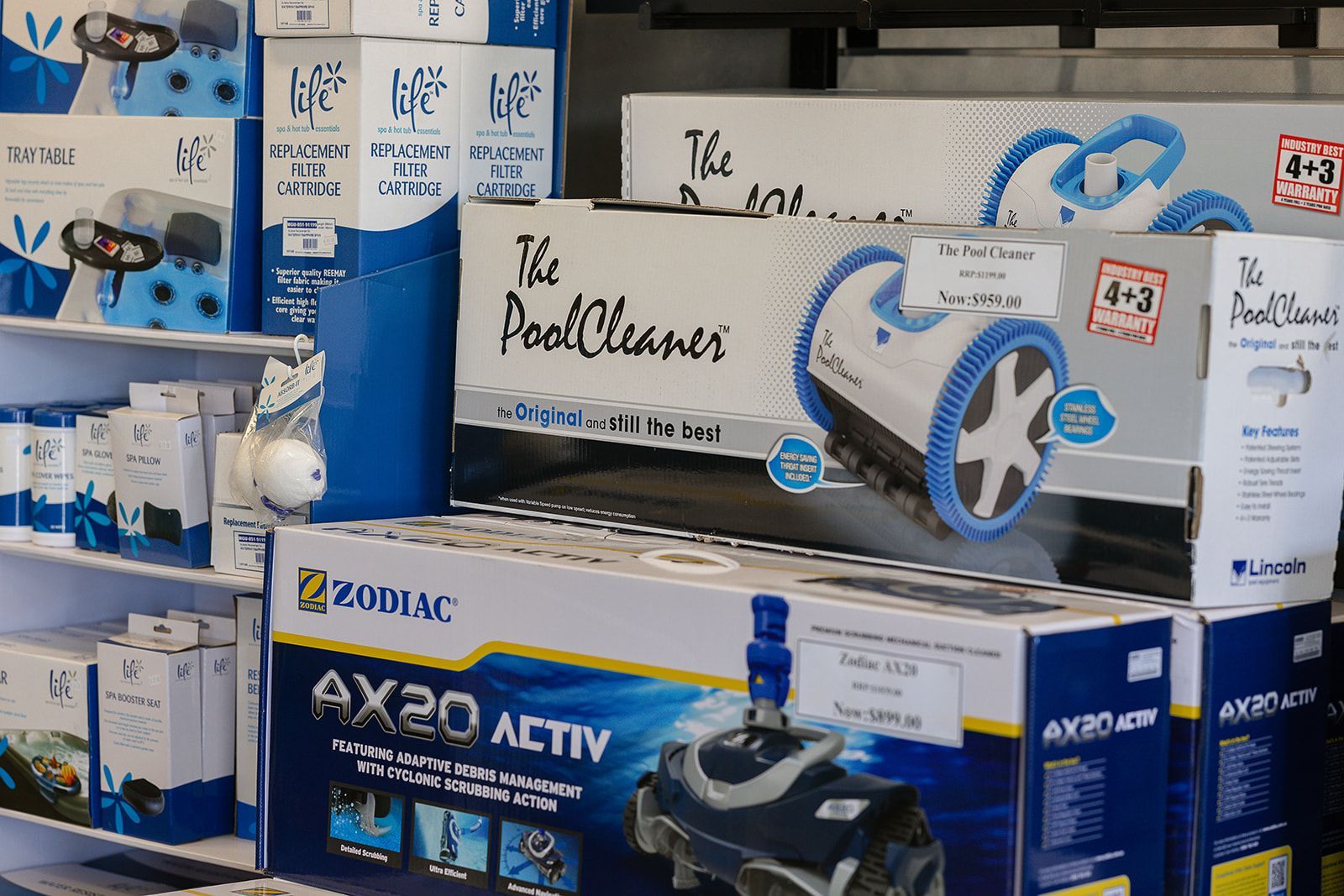 A vacuum cleaner with a hose attached to it and a yellow sign that says suitable for tub pools — Pool Zone in Laurieton, NSW