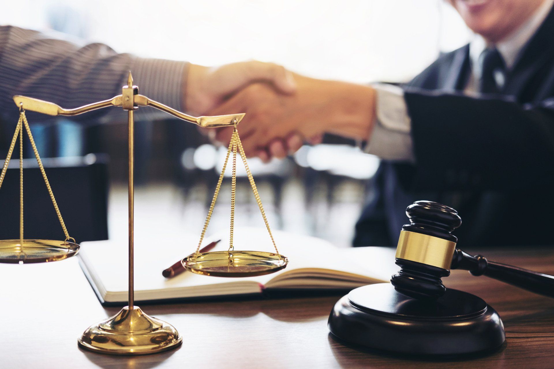 Client And Counselor Shaking Hands With Weighing Scale And Gavel — Pleasant Hill, CA — Hardisty & Hardisty