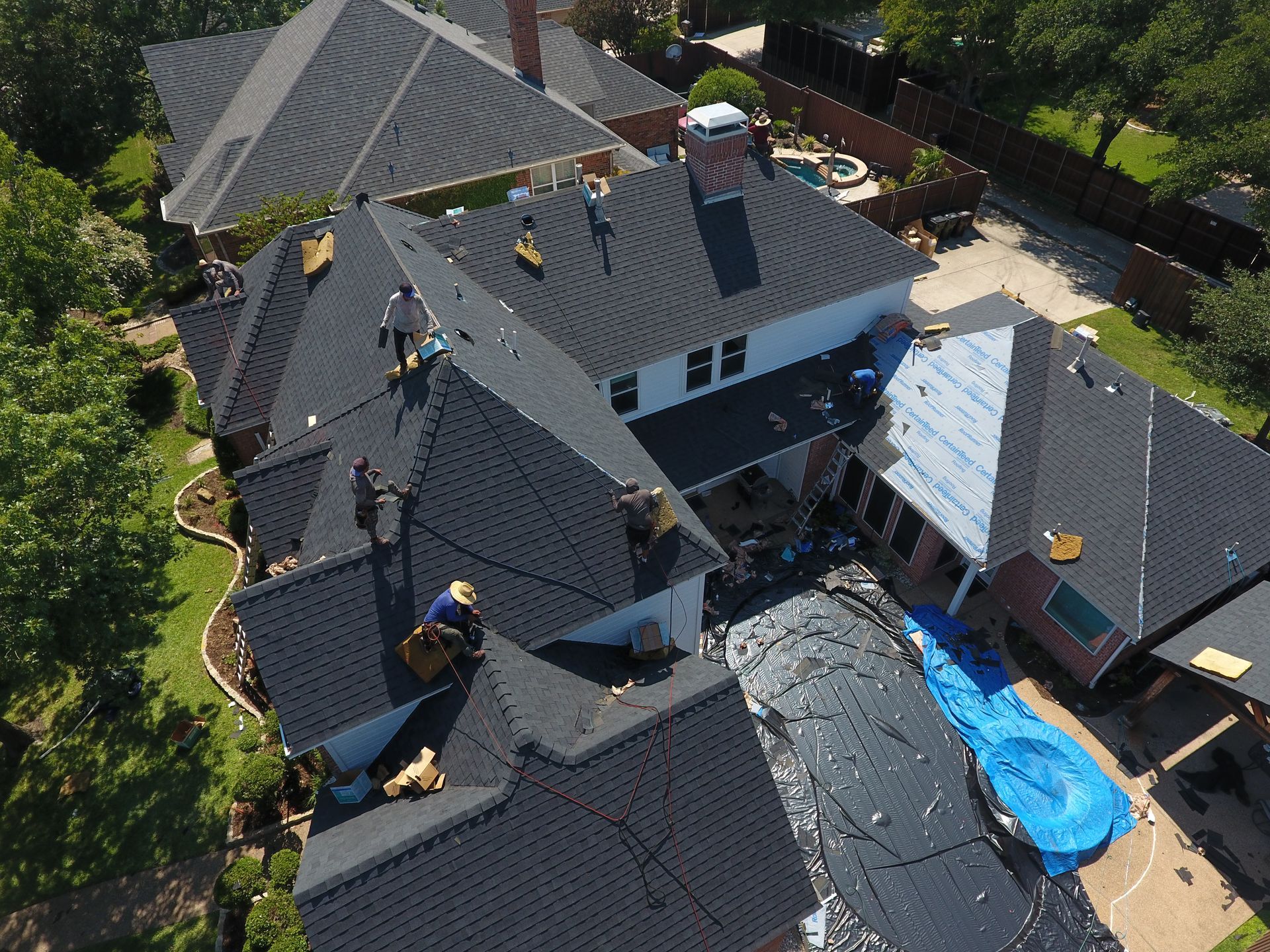 An aerial view of a house with a roof that is being built.