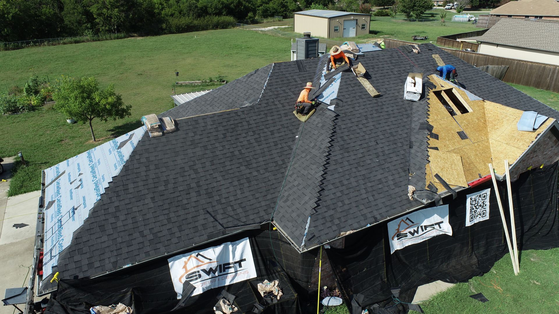 There is a chimney on the roof of a house.