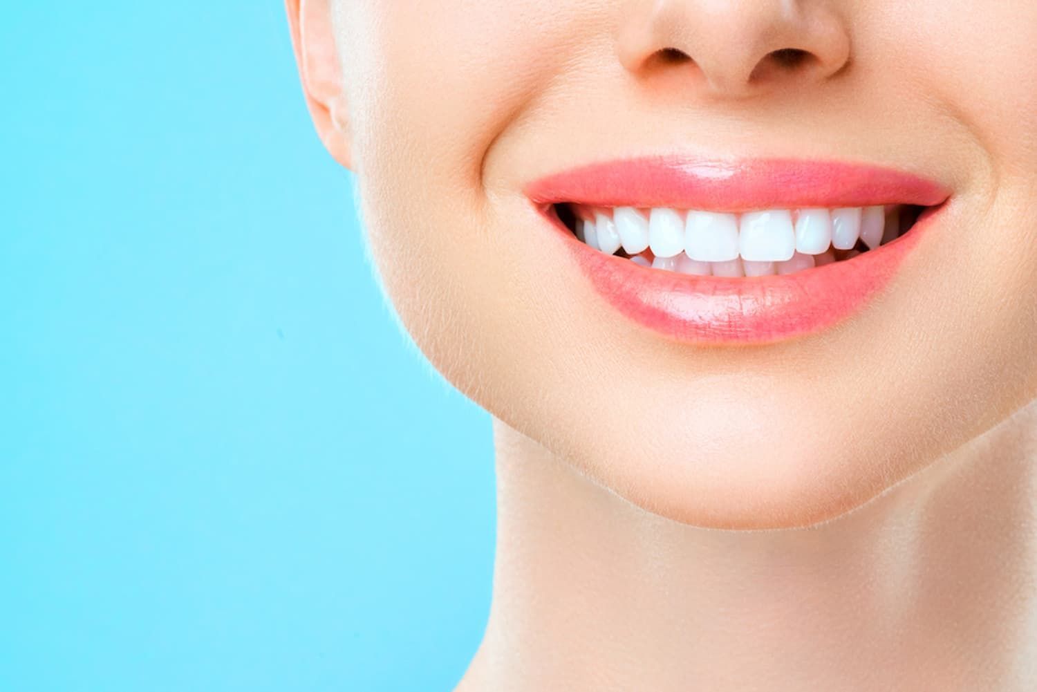 A Close-up Of a Woman's Smile with White Teeth and Pink Lips — Cane to Coast Dentures in Sarina, QLD
