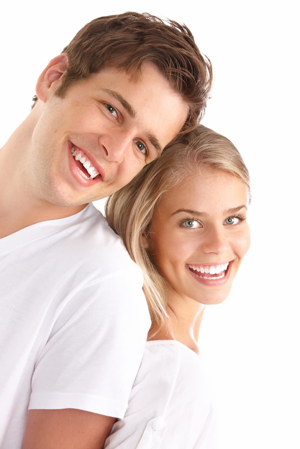 A Man and A Woman Are Smiling for The Camera — Cane to Coast Dentures in Sarina, QLD
