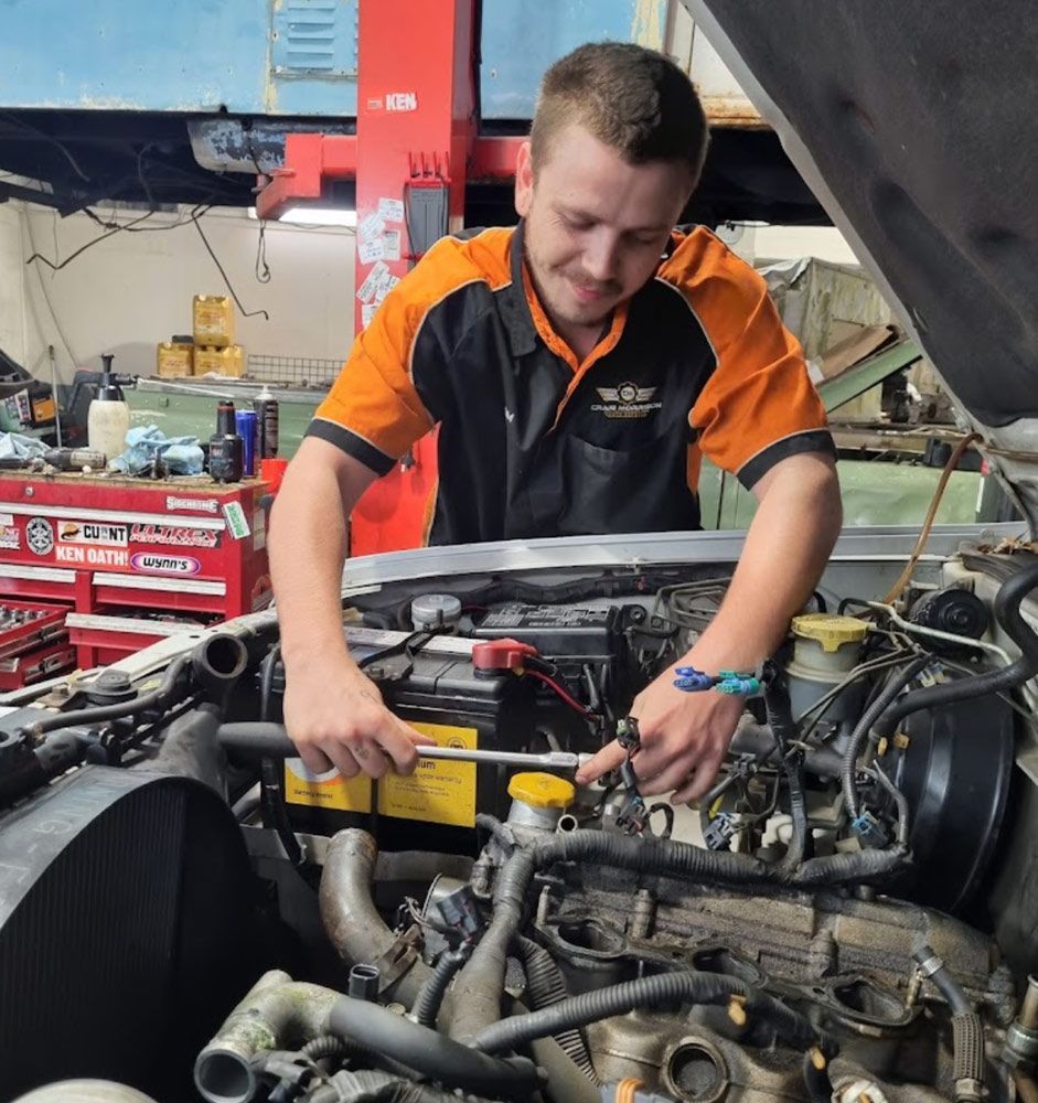 Mechanic Repairing A Car Engine With A Wrench — Mechanic In Noosaville, QLD