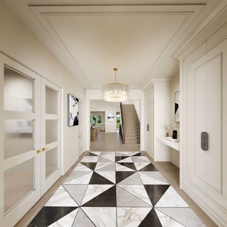 Elegant hallway with white walls, geometric black-and-white floor, chandelier, and stairs at the far end