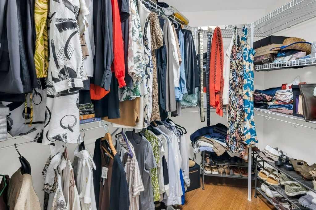 Clothing boutique interior with racks of hanging clothes and folded garments on shelves