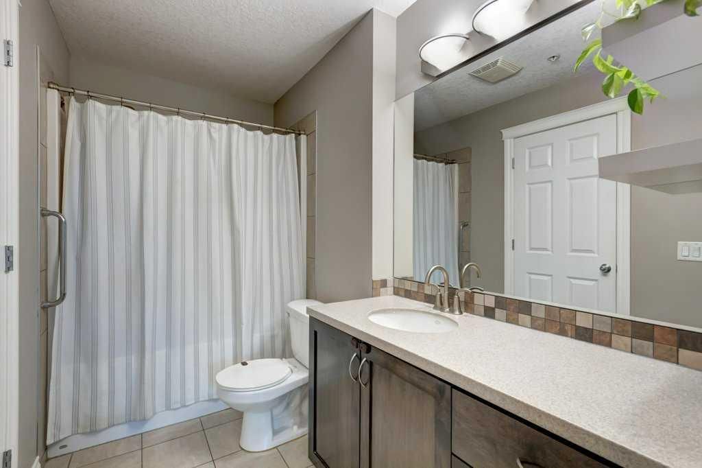 Bright nursery with crib, changing table, storage shelves, and frosted glass doors and windows