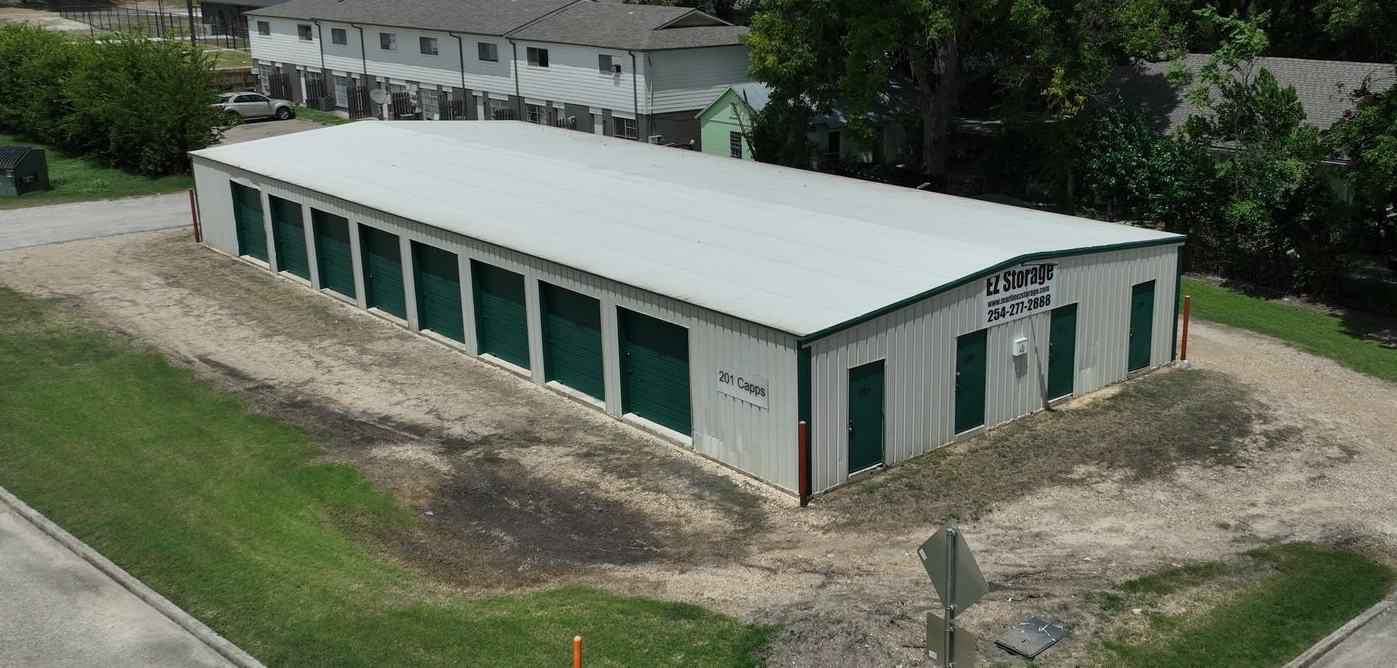 Aerial view of Marlin EZ Storage at 201 Capps Street in Marlin, TX, showing drive-up storage units with green doors