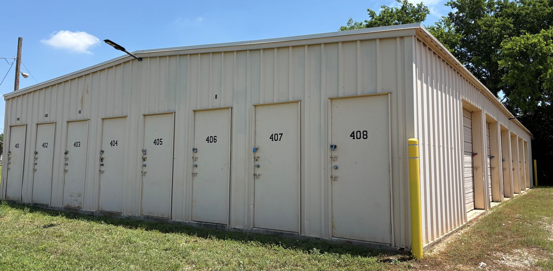 Drive-up storage units at Marlin EZ Storage in Marlin TX with numbered doors and 24/7 access
