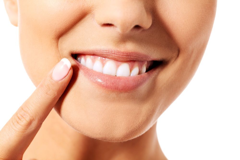 A Close Up of a Woman's Mouth With White Teeth — Graham Johnson Dental Surgery In Beresfield, NSW
